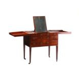A George III mahogany Gentleman's fold-out dressing table with ratcheting mirror and lidded
