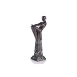 After Max Le Verrier, an Art Deco silvered and patinated figural table lamp in the form of a 1930s