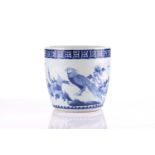 A Chinese blue & white jardiniere, the thickly potted walls painted with a crested hawk perched upon