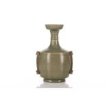 A Chinese celadon vase, in the tang style, of mallet form with wide mouth and narrow banded neck,