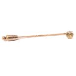 A stick pin with single diamond in a screw fitting, featuring an old-cut yellow tinted diamond
