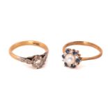 A 9ct gold multi-gem cluster ring and a diamond solitaire ring; The cluster ring features a white