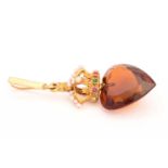 A jewelled crown and citrine pendant, consisting of a heart-shaped faceted Madeira citrine