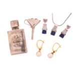 A silver cased perfume bottle with funnel, a pair of pearl drop earrings, a gem-set necklace and