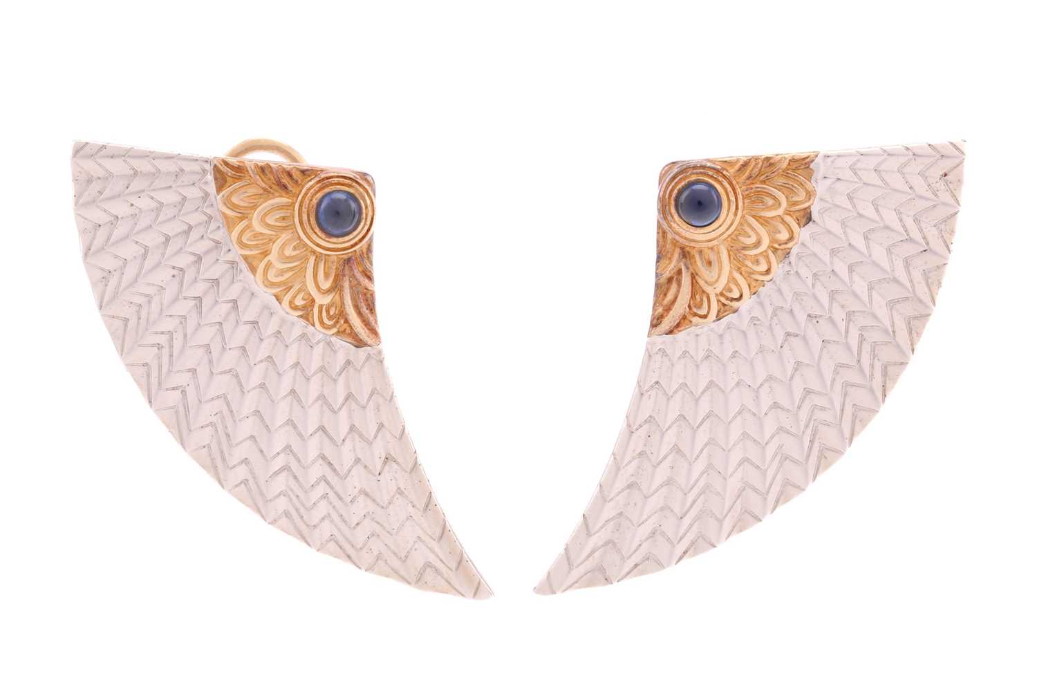 A pair of Erté 'Nile' earrings, each comprises round sapphire cabochon accents on the bi-coloured