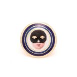 An enamel masked lady ring, round disc depicting a feminine face in a Colombina style mask painted