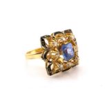 A sapphire and diamond cluster ring, the cushion mixed cut sapphire with pale cornflower blue body