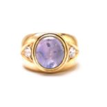A star sapphire and cubic zirconia gypsy ring, consisting of a pale blue star sapphire approximately