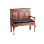 A George II style oak two-seat settle, 1920s, bearing an ivorine trade label for Arthur Newberry (
