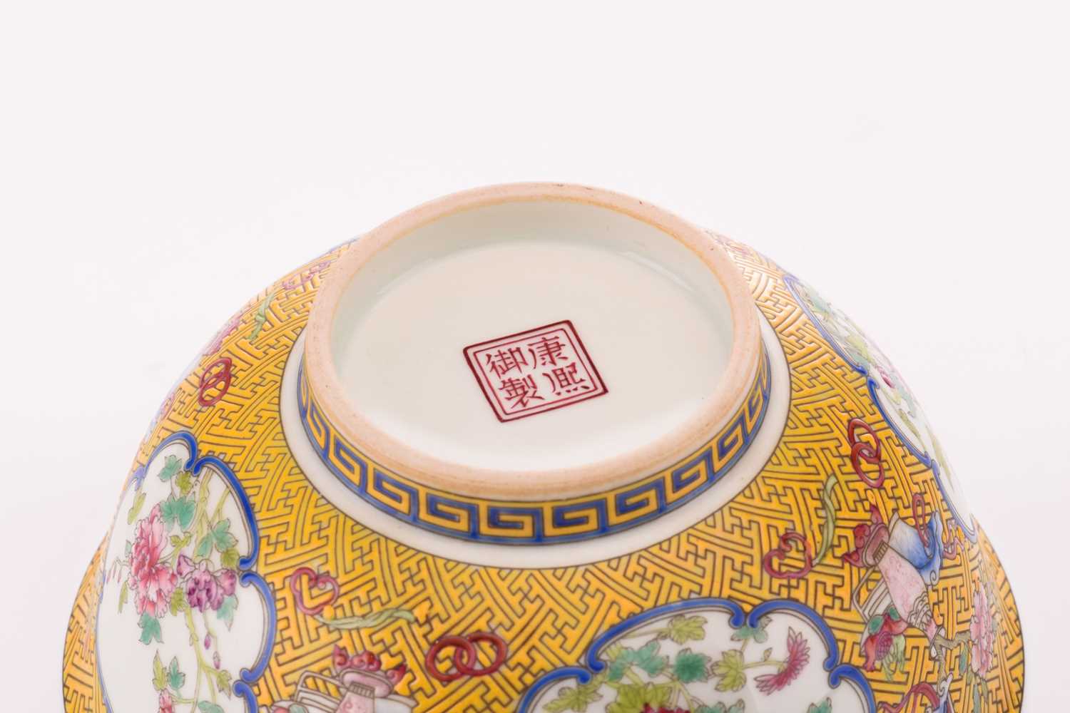 A Chinese porcelain bowl, painted with medallions of auspicious flowers and flanked by treasures, - Image 4 of 4