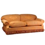 A traditionally upholstered beech framed large two-seat sofa thought to be by Peter Dudgeon & Co