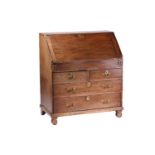 A George I/II oak fall front writing bureau, the interior with concealed drawers and a well.