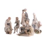 A group of five large Lladro figures, to include a mother with pram, a boy with a dog and others,