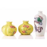 A pair of Chinese porcelain tri-lobed vases, painted with pomegranates and peaches against a