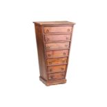 An unusual 20th-century eastern hardwood pedestal semainier chest of inverted triangular form with