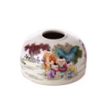 A Chinese porcelain brush washer, painted with young boys playing in a garden, apocryphal six