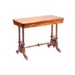 A Victorian rectangular figured burr walnut and ebony fold-over gaming table with quartered top,