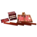 A Chinese early 20th century cased bamboo and bone Mahjong set with tile trays marked for the