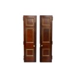 A pair of decorative Edwardian architectural three-panel mahogany and parcel gilt library doors