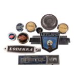 A Leyland Atlantean chrome and enamel bus badge, 38 cm wide, together with a Lodekka badge, a