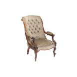 An early Victorian figured rosewood scroll back open armchair on carved cabriole legs with brass