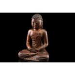 A Chinese bronze figure of Buddha, seated in dhyana mudra, the hair in tight curls, traces of