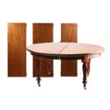 A good quality Victorian mahogany oval screw extending dining table with thee leaf inserts. On