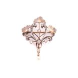 An Art Nouveau diamond and pearl brooch, with rose-cut and old-cut diamonds set in a scrolling