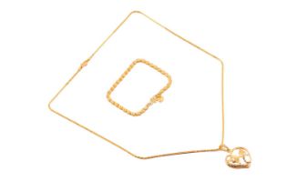 A heart pendant on chain and a bracelet with heart charm; The pendant comprises two stylised
