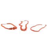 Three coral beaded necklaces; to include one with graduated branch coral beads, fastens with box