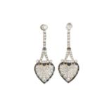 A pair of Art Deco-style diamond and sapphire drop earrings, each of the amphora-shaped earrings