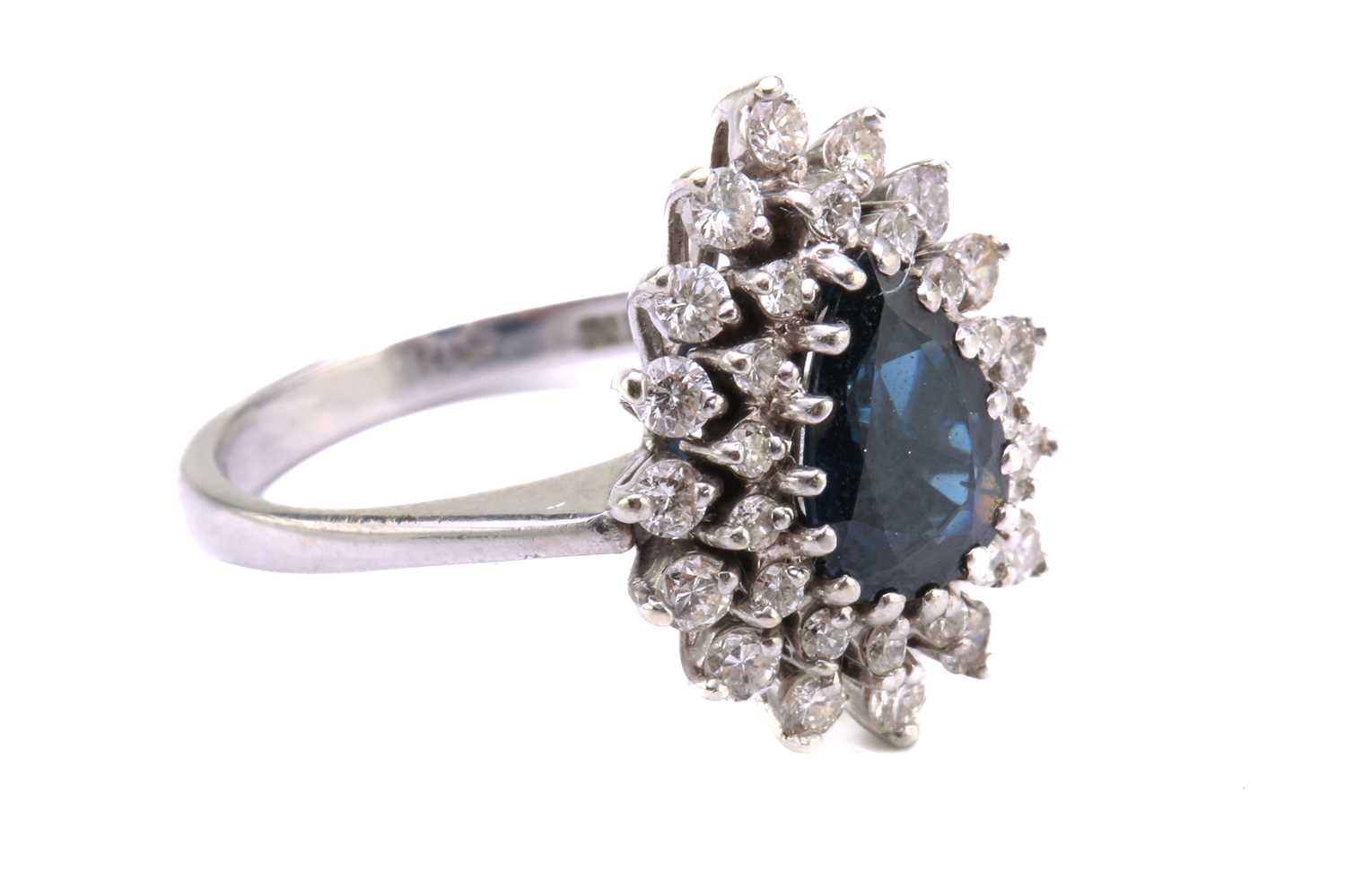 A sapphire and diamond entourage ring, featuring a pear-shaped sapphire in dark blue colour, - Image 2 of 4