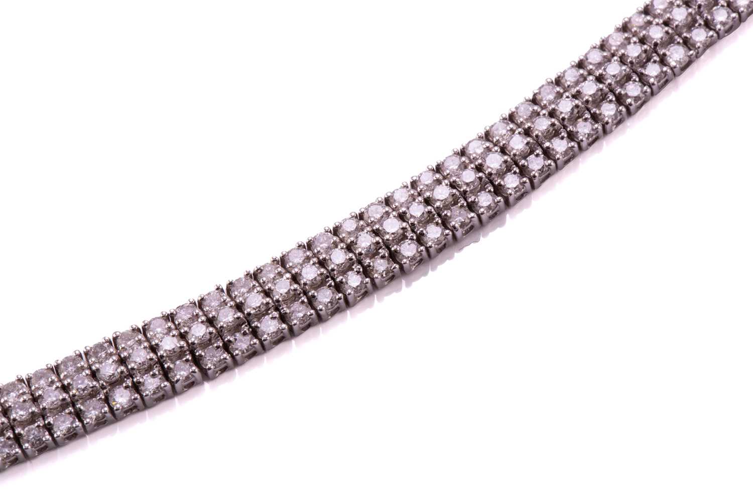 A three-row diamond tennis bracelet, featuring arrays of brilliant diamond with an estimated total - Image 3 of 9