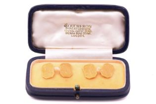 A pair of 18 carat gold cufflinks in an associated Boucheron cufflink box. the rectangular cut-