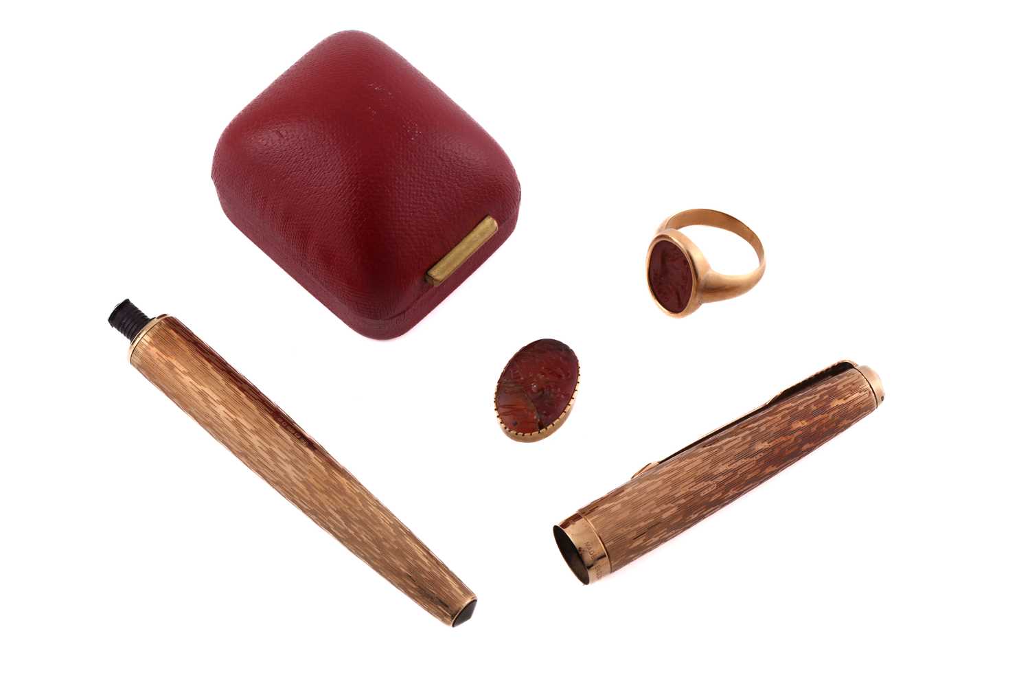 An intaglio ring, a dress stud and a broken Parker pen; to include a signet ring with lion