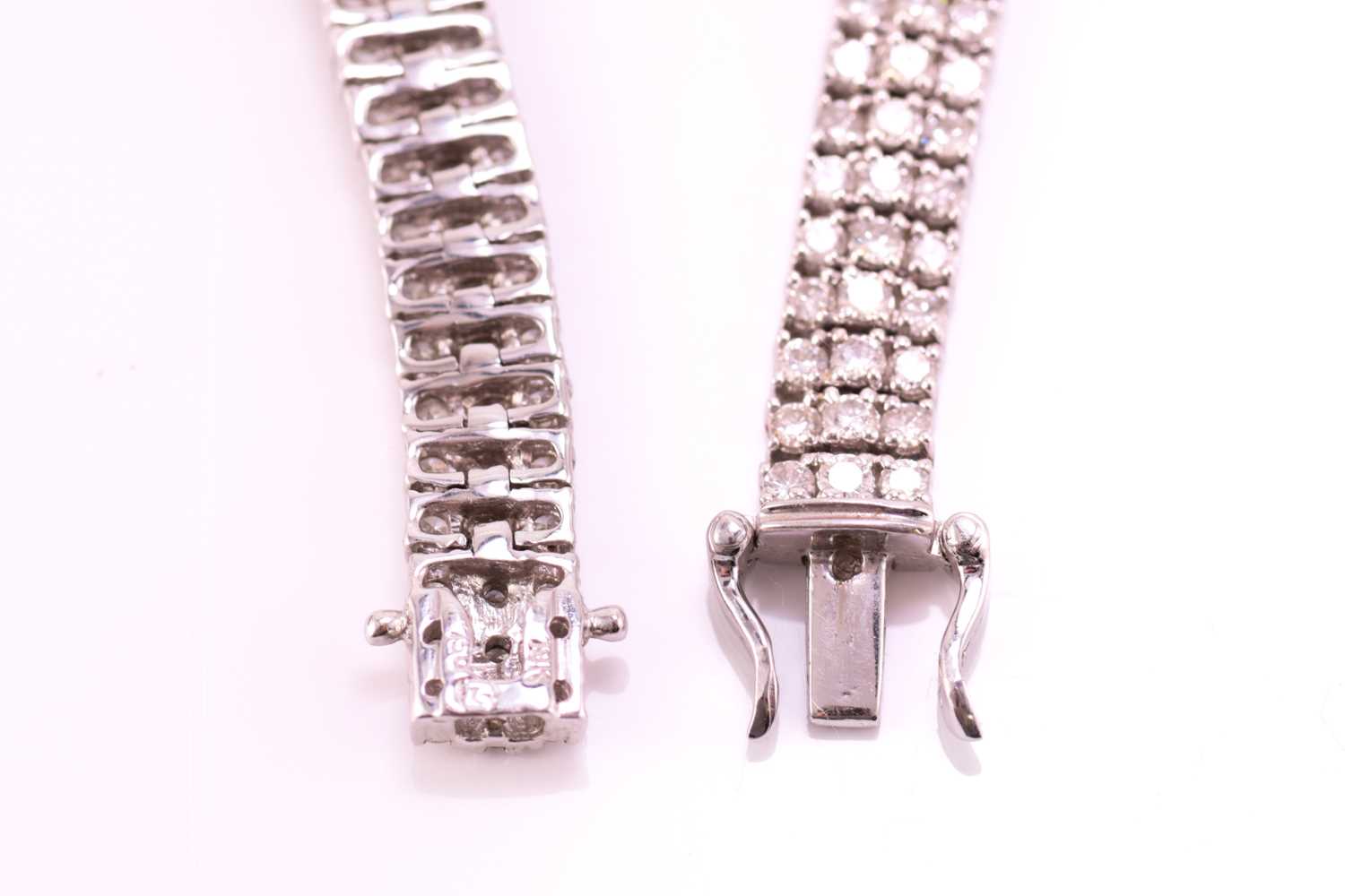 A three-row diamond tennis bracelet, featuring arrays of brilliant diamond with an estimated total - Image 8 of 9
