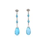 A pair of blue topaz drop earrings in 9ct white gold, each consists of two claw set pear-cut