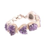 An amethyst cluster bracelet, consisting of six free-forming amethyst druzy crystal aggregates,