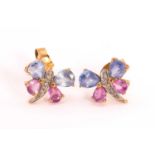 A pair of butterfly earrings in 9ct gold, each comprises a set of four pear-shaped blue and pink