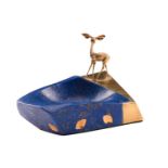 An 18 carat gold and lapis lazuli model of a fawn at a drinking pool. Stylised and geometric
