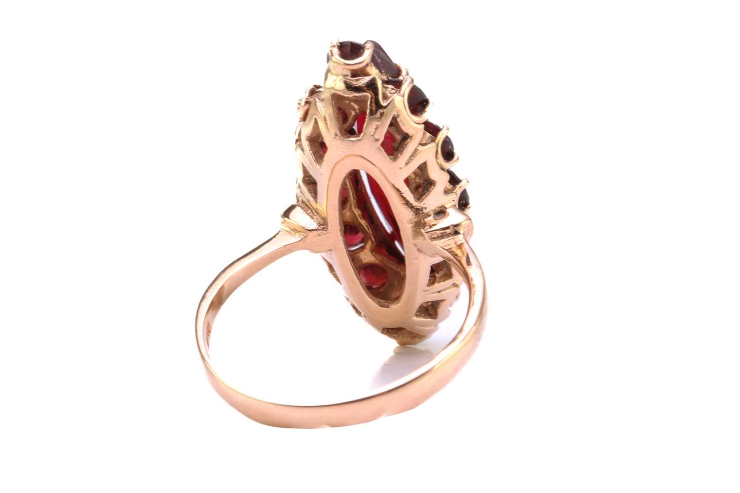 A synthetic ruby and garnet dress ring, comprises a marquise-shaped synthetic ruby claw-set on a - Image 2 of 3