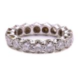 A diamond eternity ring, featuring seventeen brilliant-cut diamonds six-claw set in the mount, metal