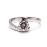 A diamond solitaire bypass ring in platinum, featuring a brilliant diamond claw set in bypass