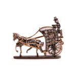 A horse-drawn carriage brooch set with diamonds, in the form of a Hansom cab, the horse, cabriolet