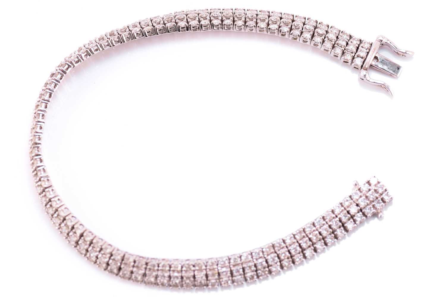 A three-row diamond tennis bracelet, featuring arrays of brilliant diamond with an estimated total - Image 6 of 9