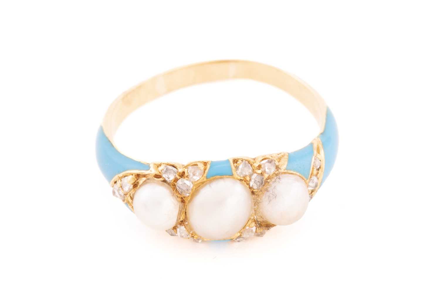 A pearl and diamond enamel ring, comprises three off-round split pearls set on a sky blue enamel