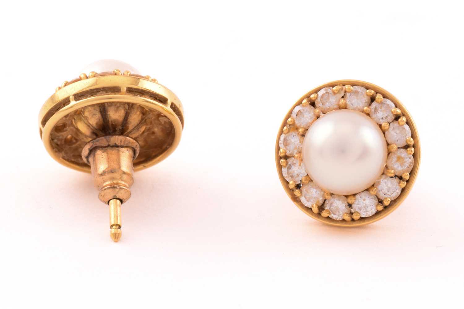 A pair of pearl and diamond earrings in 18ct gold, each consisting of a 7.0 mm round pearl, set - Image 2 of 6