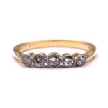 A five-stone diamond half hoop ring, comprises five graduated diamonds set in collets with millgrain