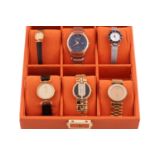 A collection of six assorted quartz watches, including a Raymond Weil minimalist dress watch, a