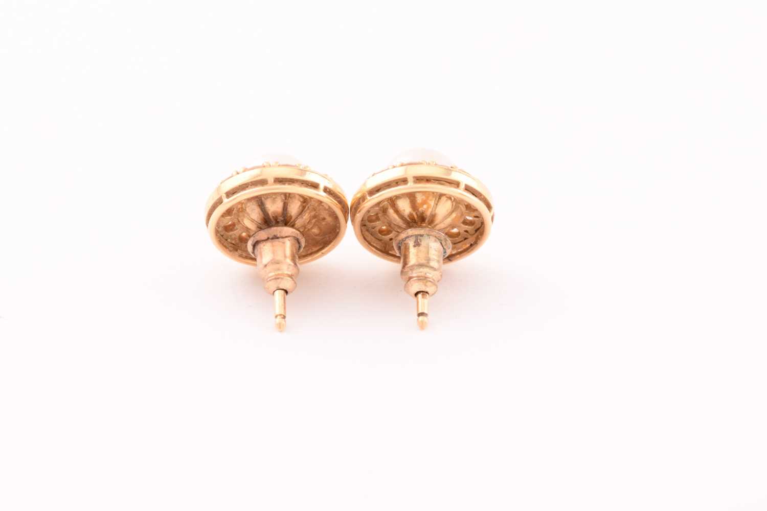 A pair of pearl and diamond earrings in 18ct gold, each consisting of a 7.0 mm round pearl, set - Image 4 of 6